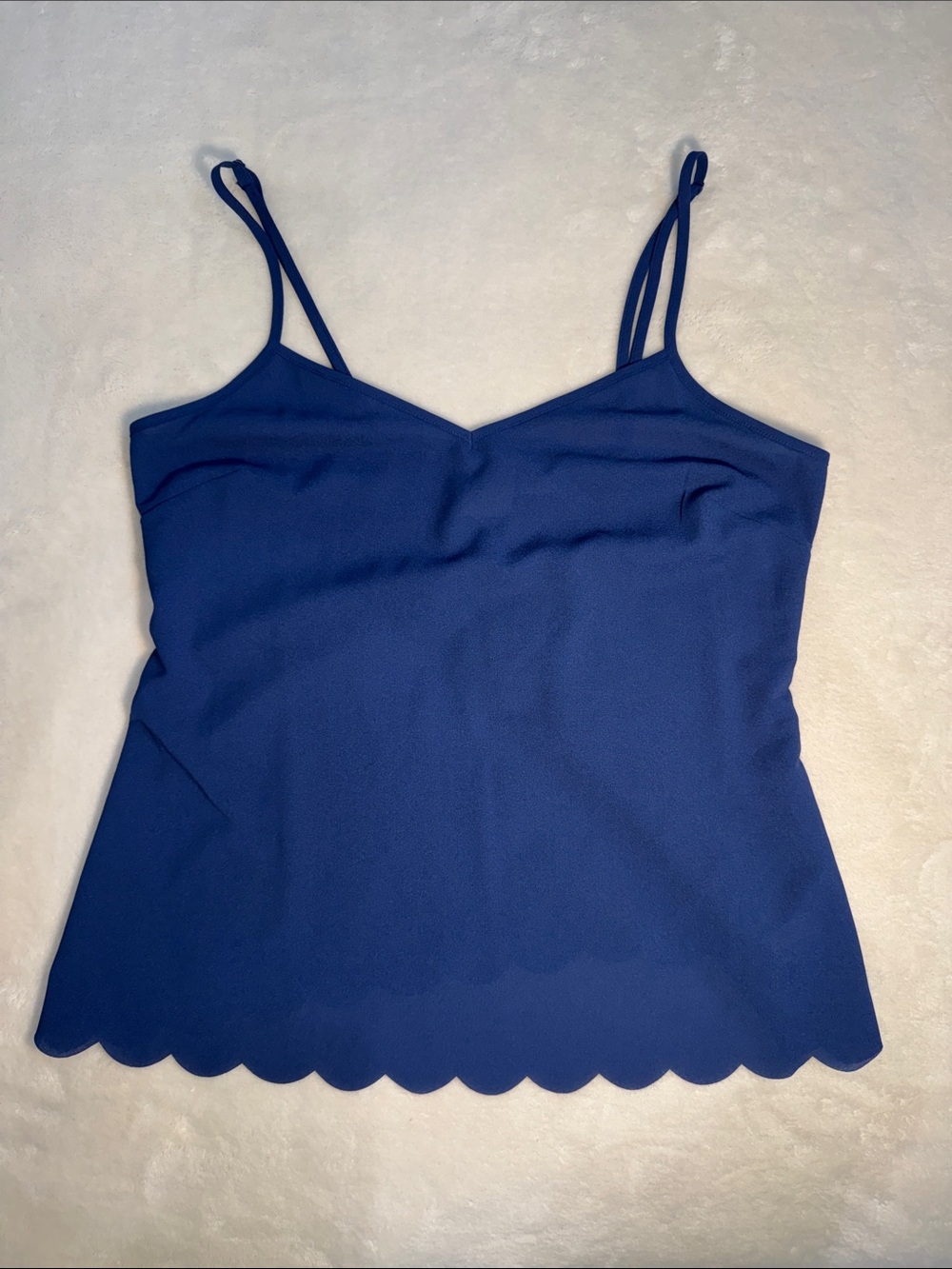 Anthropologie by Eloise. NWT. Blue poly top with scalloped edge. S.